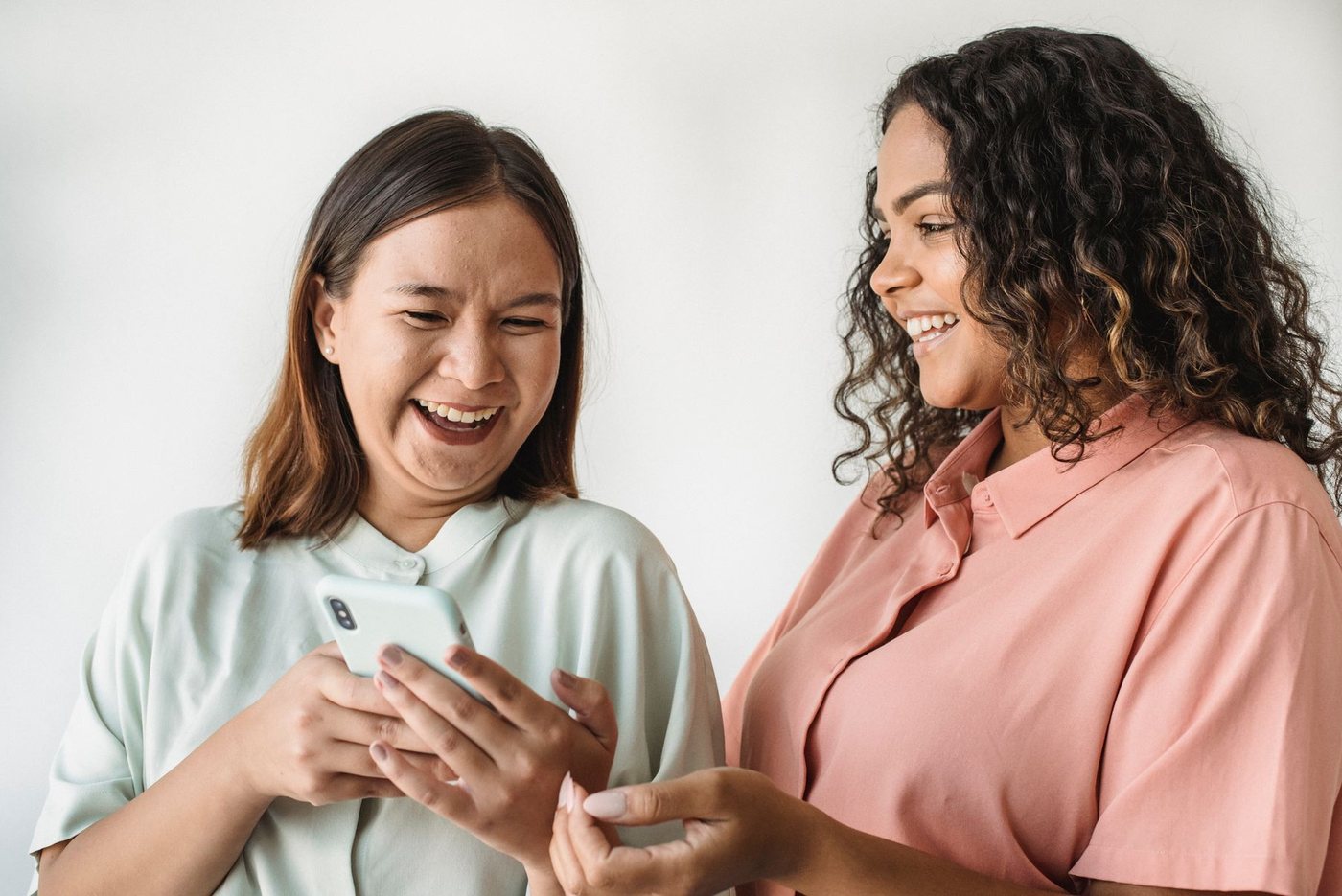 Two women laughing together